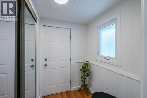 Foyer on side of kitchen opening to the courtyard at 860 Fairview Road, Oliver
