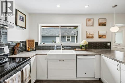 Kitchen with new farmhouse sink at 860 Fairview Road, Oliver