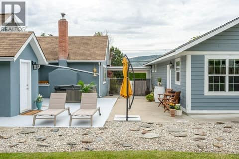 Main house on left, guest house on right at 860 Fairview Road, Oliver