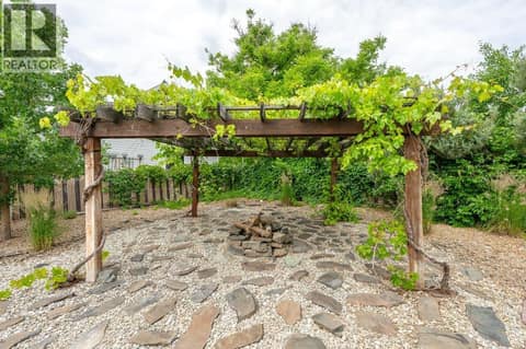 Pergola with grape vines at 860 Fairview Road, Oliver