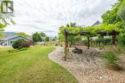 Pergola with grape vines at 860 Fairview Road, Oliver