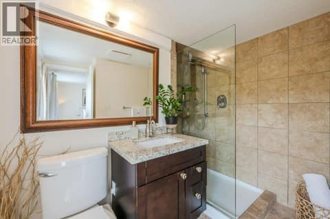 Primary bedroom ensuite - granite counters at 860 Fairview Road, Oliver