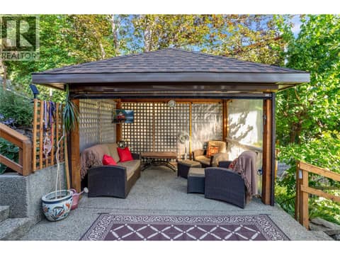 Side lounge/cabana area off the family room (main level) at 1988 Dewdney Road, McKinley Landing, Kelowna