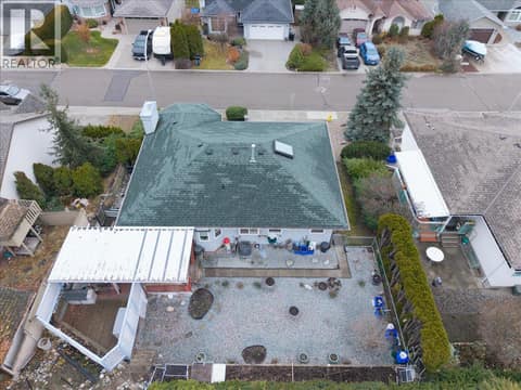 Looking down into backyard and the covered patio at 4205 Wellington Drive, East Hill, Vernon