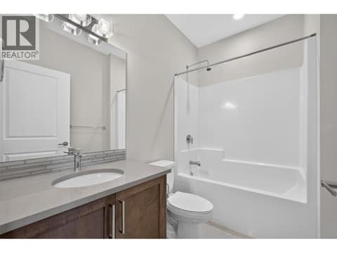 Full bathroom on the upper level, complete with a shower and tub combination! at 12840 Stillwater Court Unit# 11, Lake Country North West