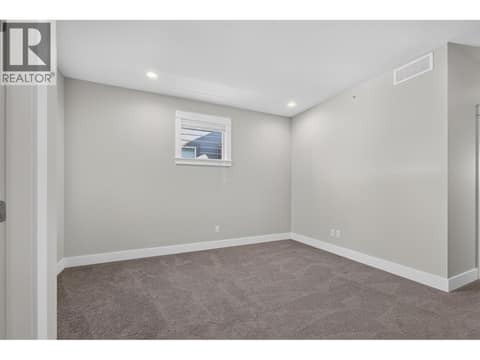 Versatile upper-level nook, perfect for a kids' play area, cozy TV lounge, or additional family space! at 12840 Stillwater Court Unit# 11, Lake Country North West