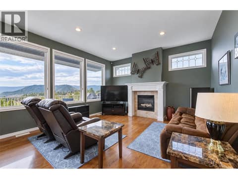 Family room with gas fireplace and valley views! at 2280 Shannon Hills Drive, Shannon Lake, West Kelowna