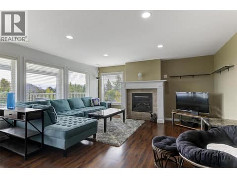 In-law suite living room with gas fireplace at 2280 Shannon Hills Drive, Shannon Lake, West Kelowna