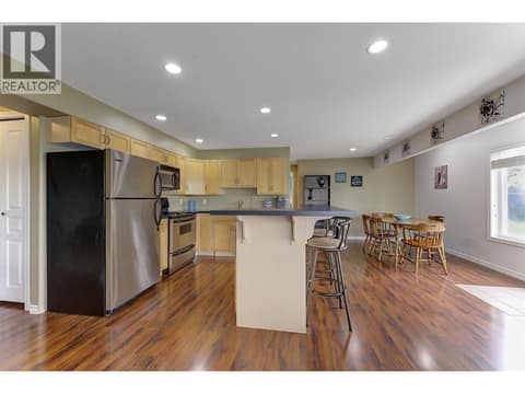 In-Law suite kitchen and dining area at 2280 Shannon Hills Drive, Shannon Lake, West Kelowna