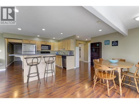In-law suite dining to kitchen at 2280 Shannon Hills Drive, Shannon Lake, West Kelowna