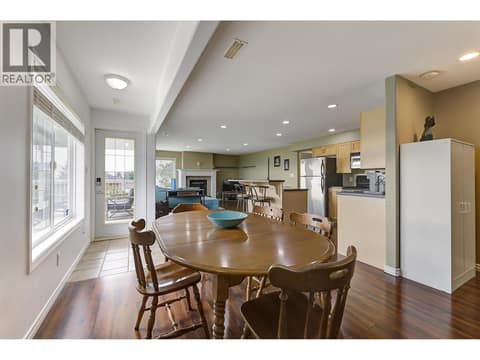 In-law suite dining to family room and access to lower covered patio at 2280 Shannon Hills Drive, Shannon Lake, West Kelowna