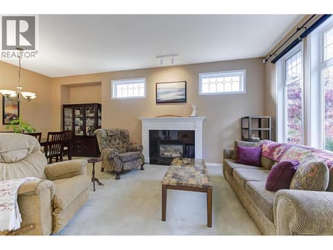 Living room with gas fireplace at 2280 Shannon Hills Drive, Shannon Lake, West Kelowna