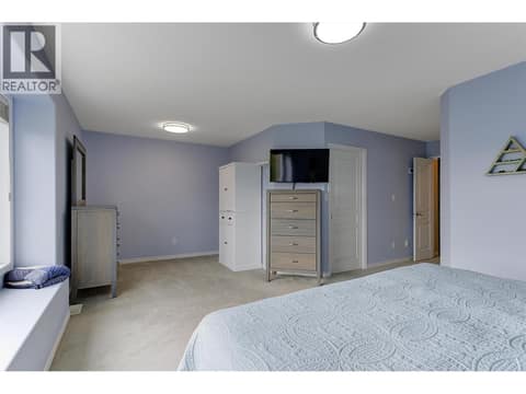 Primary bedroom with room for a sitting area at 2280 Shannon Hills Drive, Shannon Lake, West Kelowna