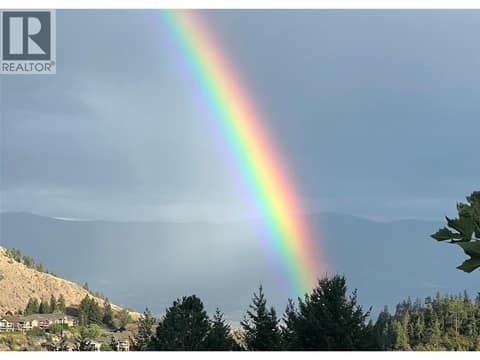 The view from the deck during a summer rainshower. at 2280 Shannon Hills Drive, Shannon Lake, West Kelowna