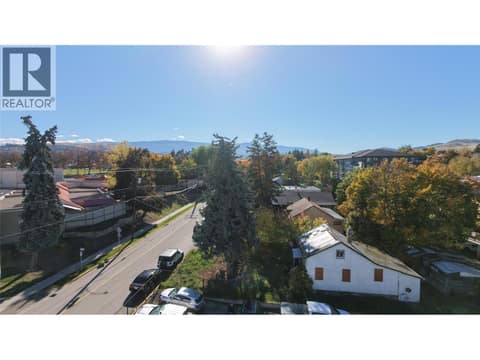 Aerial view looking south over 3 rooftops at 1900-1902-1904 31 Street, City of Vernon