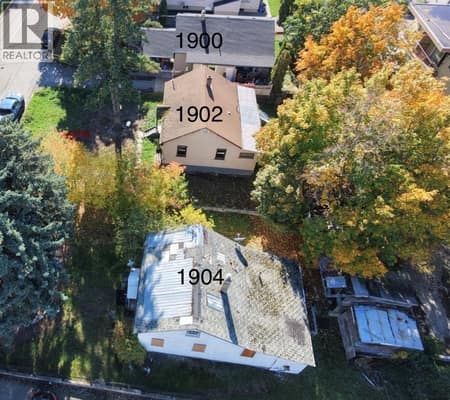 Side view of 3 properties looking south with numbers noting the addresses. at 1900-1902-1904 31 Street, City of Vernon