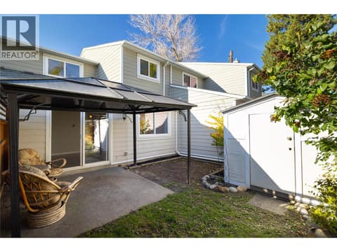 Covered patio, grass and dirt at 4910 25 Avenue Unit# 24, Okanagan Landing, Vernon