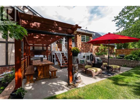 Side yard and pergola off kitchen at 6450 Meadowland Crescent S, Barnhartvale, Kamloops