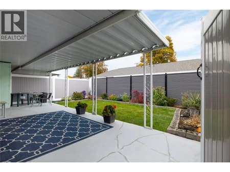 Covered patio in very private back yard at 3900 27 Avenue Unit# 2, Westmount, Vernon