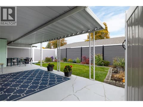 Covered patio in very private back yard at 3900 27 Avenue Unit# 2, Westmount, Vernon