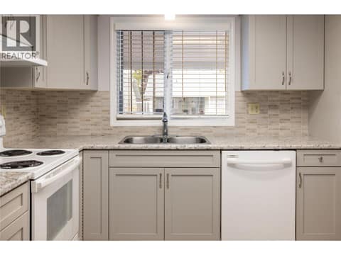 Newer cabinets, backsplash tile and blinds at 3900 27 Avenue Unit# 2, Westmount, Vernon