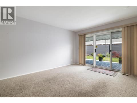 Sliding glass doors to covered patio at 3900 27 Avenue Unit# 2, Westmount, Vernon