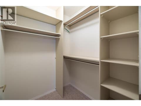 Walk-in closet with built in shelving at 3900 27 Avenue Unit# 2, Westmount, Vernon