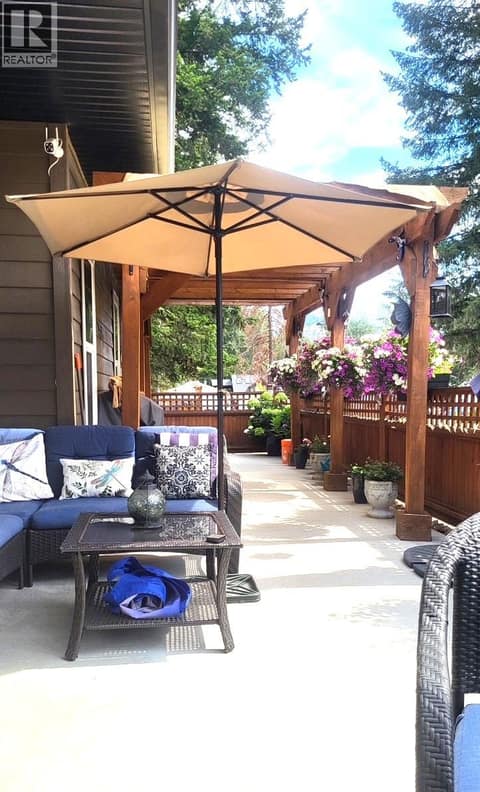 Summer view of the back patio at 259 Grouse Avenue, Okanagan North, Vernon