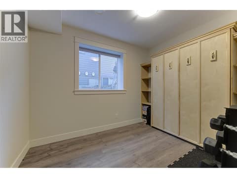 Den with built-in Murphy bed at 13371 Apex Lane, Lake Country East / Oyama