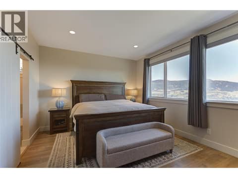 Main floor primary bedroom at 13371 Apex Lane, Lake Country East / Oyama