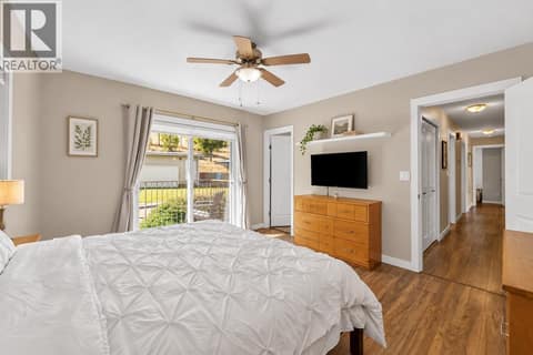 Primary Bedroom Photo has been altered with AI to show neutral colour scheme at 2045 Valleyview Drive, Valleyview, Kamloops