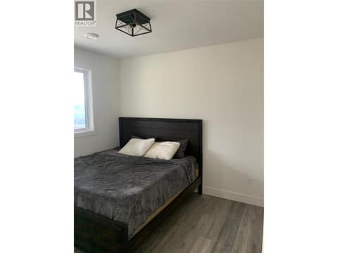 Bedroom of the Suite (photo from when the suite was vacant) at 7151 Apex Drive, Foothills, Vernon