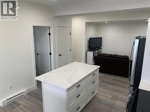 Kitchen Island (photo from when the suite was vacant) at 7151 Apex Drive, Foothills, Vernon