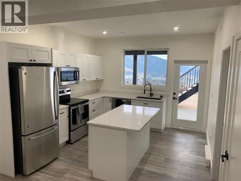 Kitchen of the Suite (photo from when the suite was vacant) at 7151 Apex Drive, Foothills, Vernon