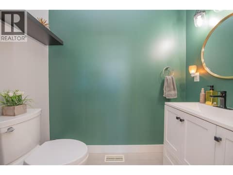 Powder room on the main floor at 342 Lumby Mabel Lake Road, Mabel Lake South, Lumby