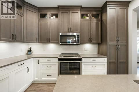 Ceiling-height cabinetry at 2450 Radio Tower Road Unit# 70, Oliver Rural