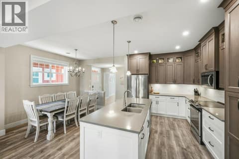 Kitchen & dining area, looking towards front entrance at 2450 Radio Tower Road Unit# 70, Oliver Rural