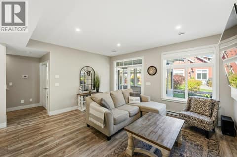 Living room with sunroom access at 2450 Radio Tower Road Unit# 70, Oliver Rural