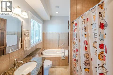 4-piece ensuite with walk-in shower & soaker tub at 1124 Fairview Road, Oliver