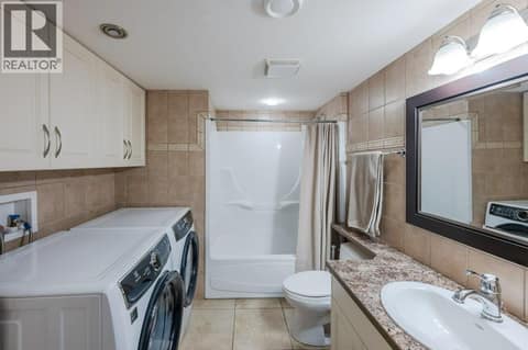 Basement 4-piece bath & laundry at 1124 Fairview Road, Oliver