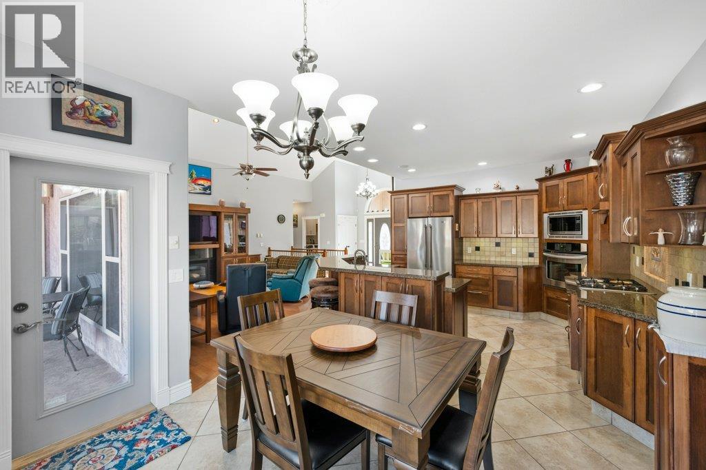 Dining room, patio door to covered deck at 1124 Fairview Road, Oliver