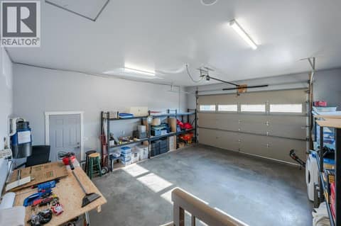 Double Garage with shelving at 1124 Fairview Road, Oliver