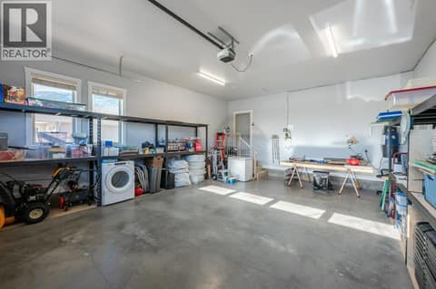 Double Garage with shelving at 1124 Fairview Road, Oliver