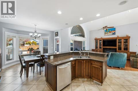 Kitchen island with granite counters at 1124 Fairview Road, Oliver
