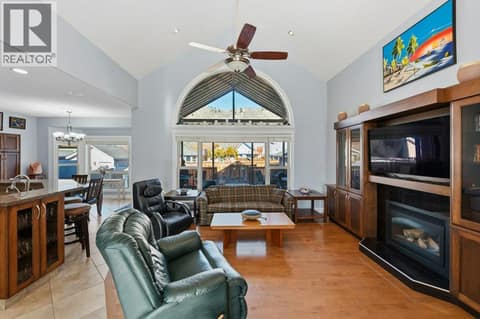 Living room, gas fireplace, vaulted ceiling at 1124 Fairview Road, Oliver
