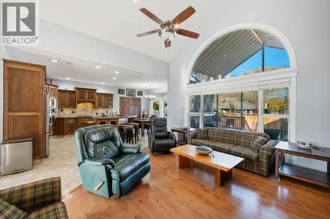 Living room, gas fireplace, vaulted ceiling at 1124 Fairview Road, Oliver