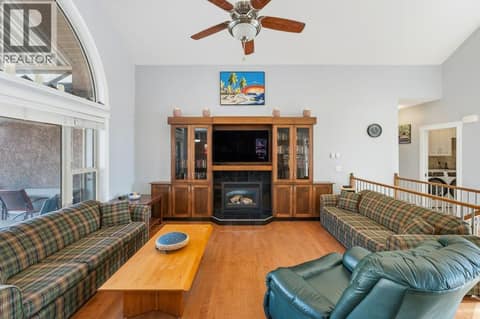 Living room, gas fireplace, vaulted ceiling at 1124 Fairview Road, Oliver