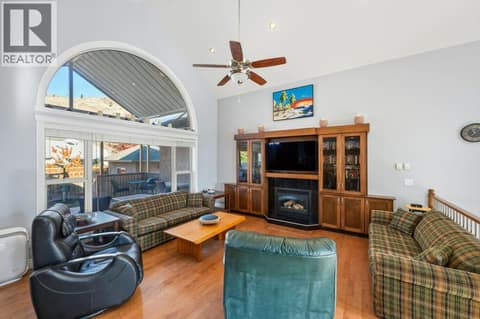 Living room, gas fireplace, vaulted ceiling at 1124 Fairview Road, Oliver